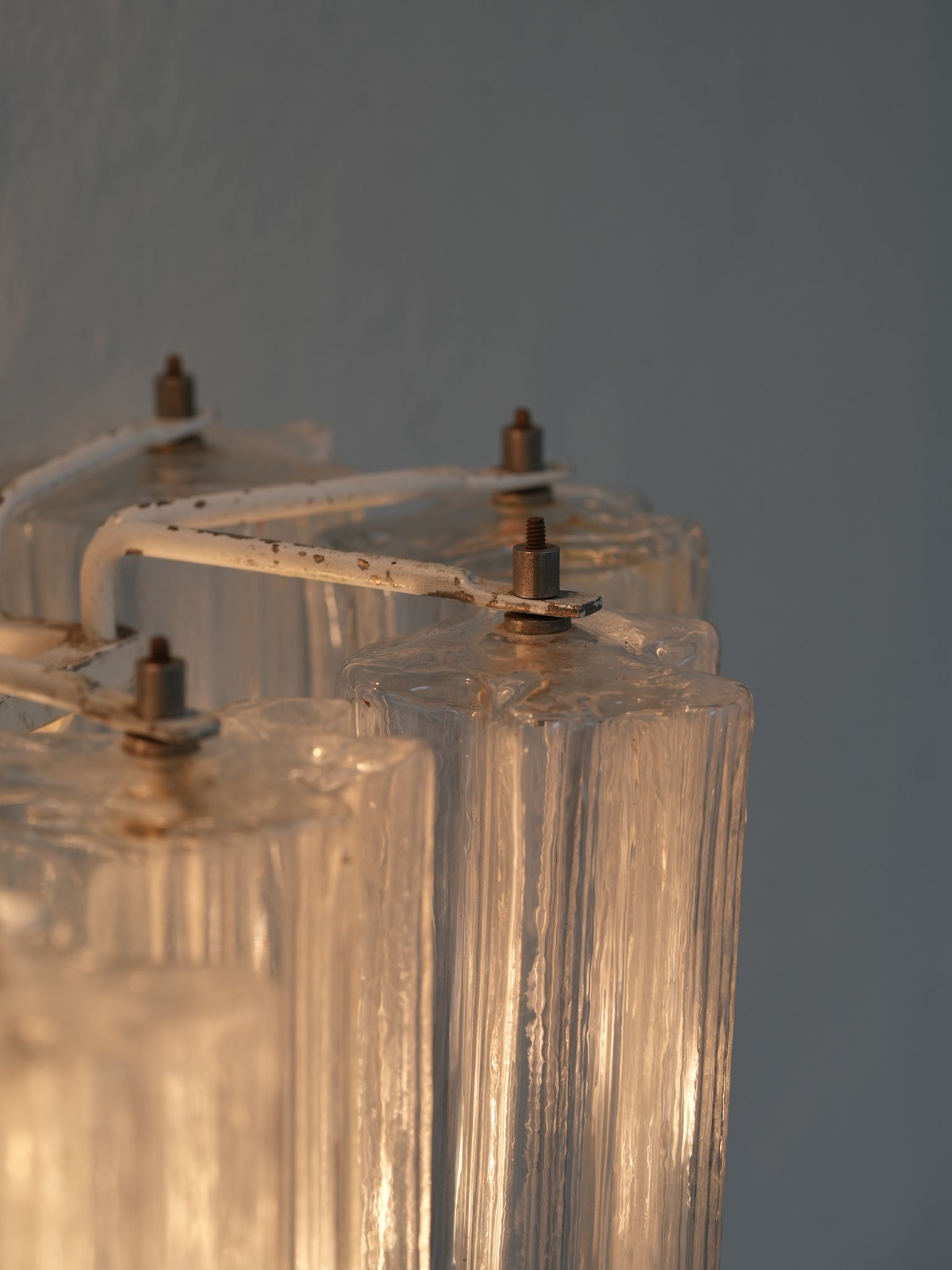 Pair of vintage Venini wall lights in clear Murano glass with a metal frame, crafted in Italy, 1960s. Available at RUE VERTE, Copenhagen's destination for vintage and contemporary art, lighting and furniture.