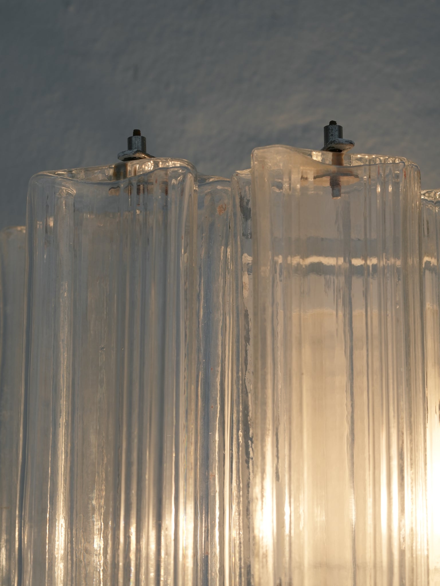 Pair of vintage Venini wall lights in clear Murano glass with a metal frame, crafted in Italy, 1960s. Available at RUE VERTE, Copenhagen's destination for vintage and contemporary art, lighting and furniture.